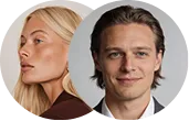 Side profile of blonde woman beside smiling man with light brown hair in front of a plain background.