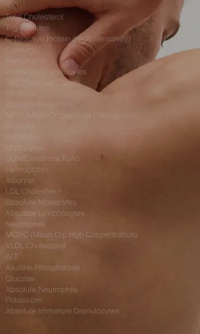 Close-up of a person's back and hand touching their upper back and neck area.