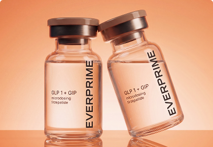 Two glass bottles labeled EVERPRIME containing GLP 1 + GIP tirzepatide on an orange background.