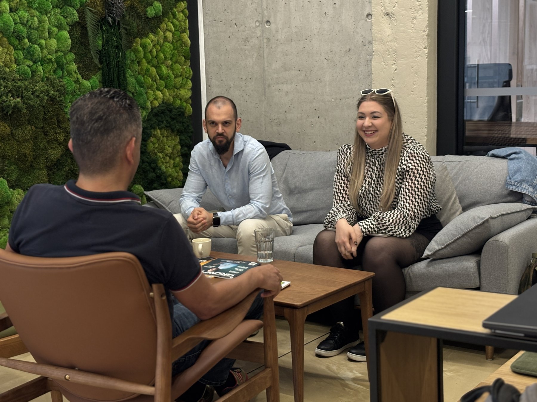 The InnoMaker Partners team in a working session around a table in their studio
