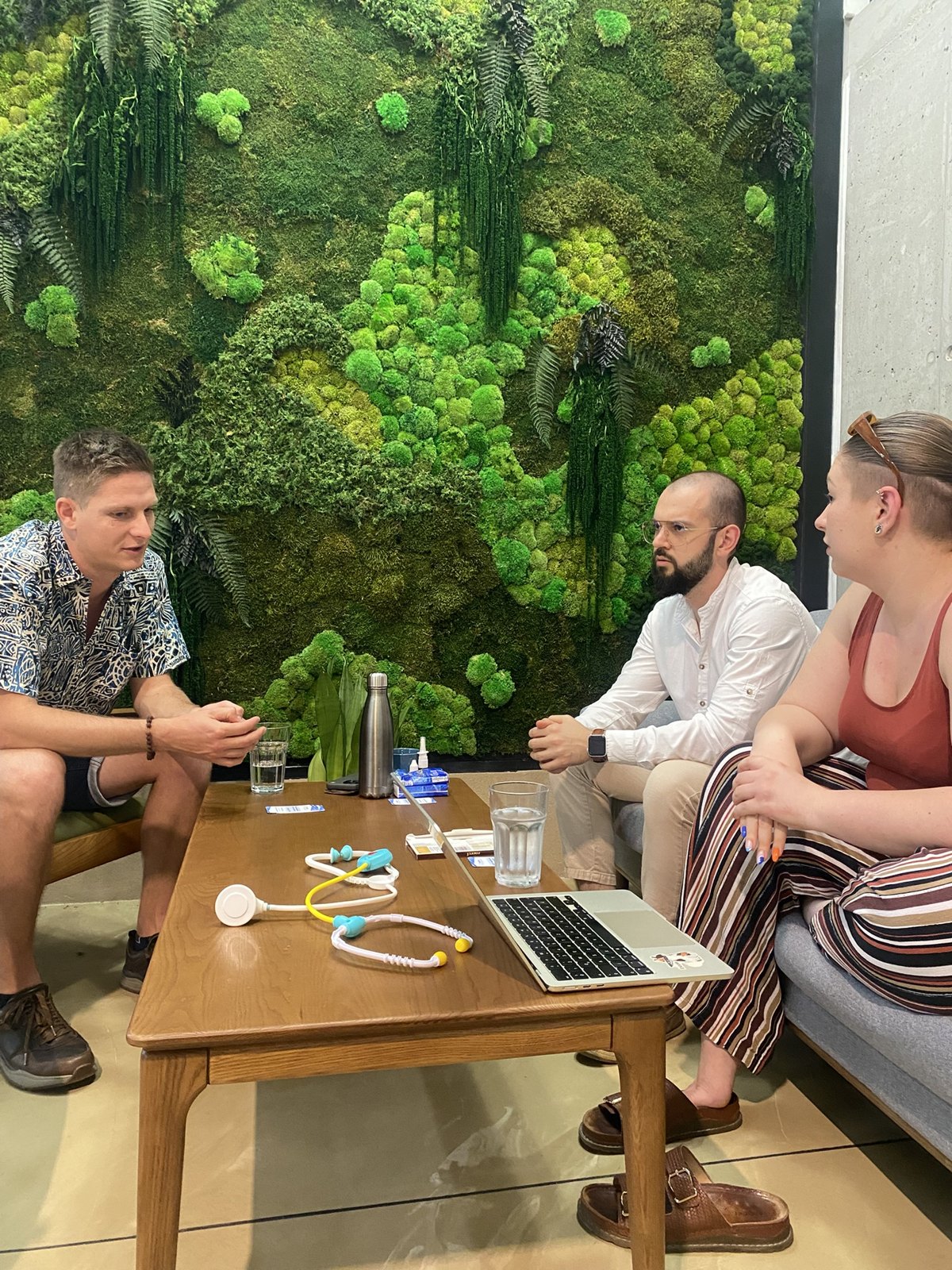 The InnoMaker Partners team working through a task together at a laptop
