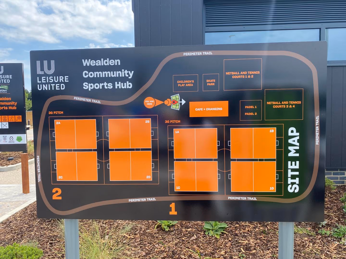 Site map of Wealden Community Sports Hub showing sports facilities layout with pitches, courts, and amenities.