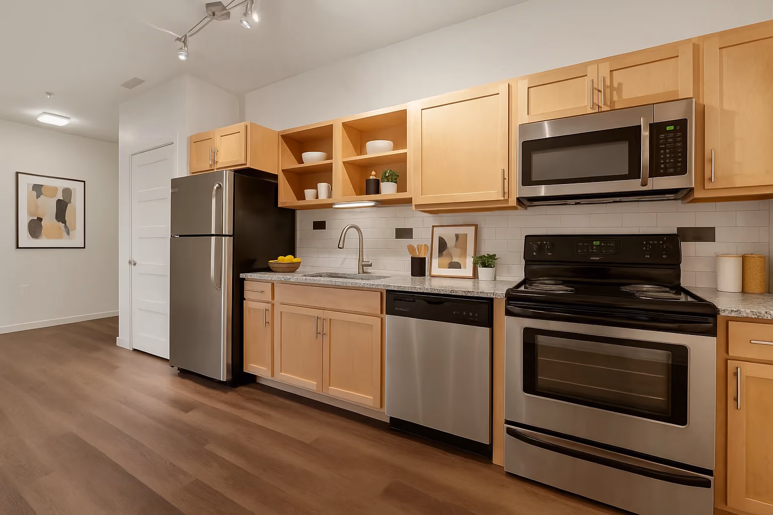 Kitchen with brown cabinets and stainless steel appliances