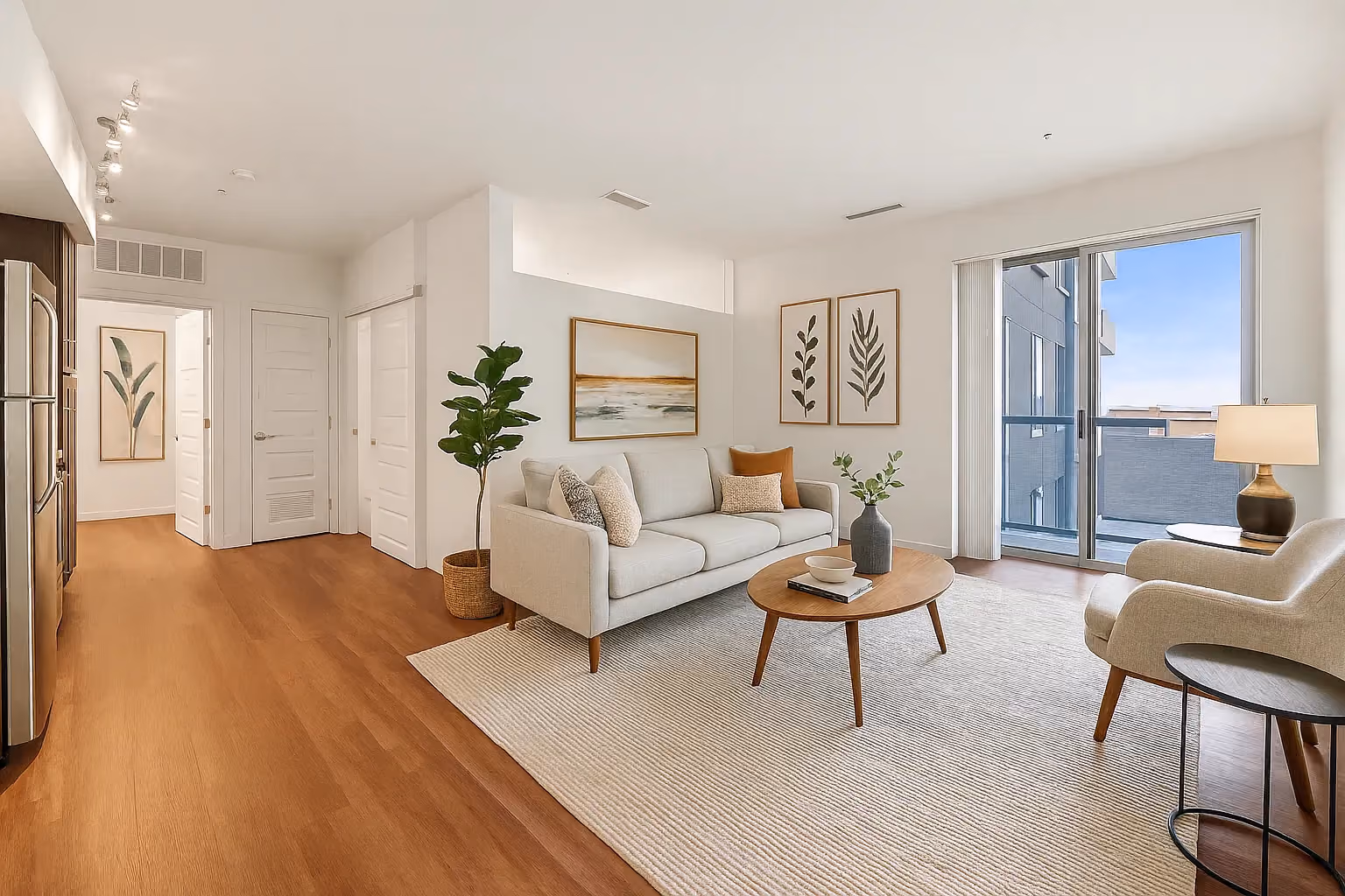 Living room with beige carpet and white couch