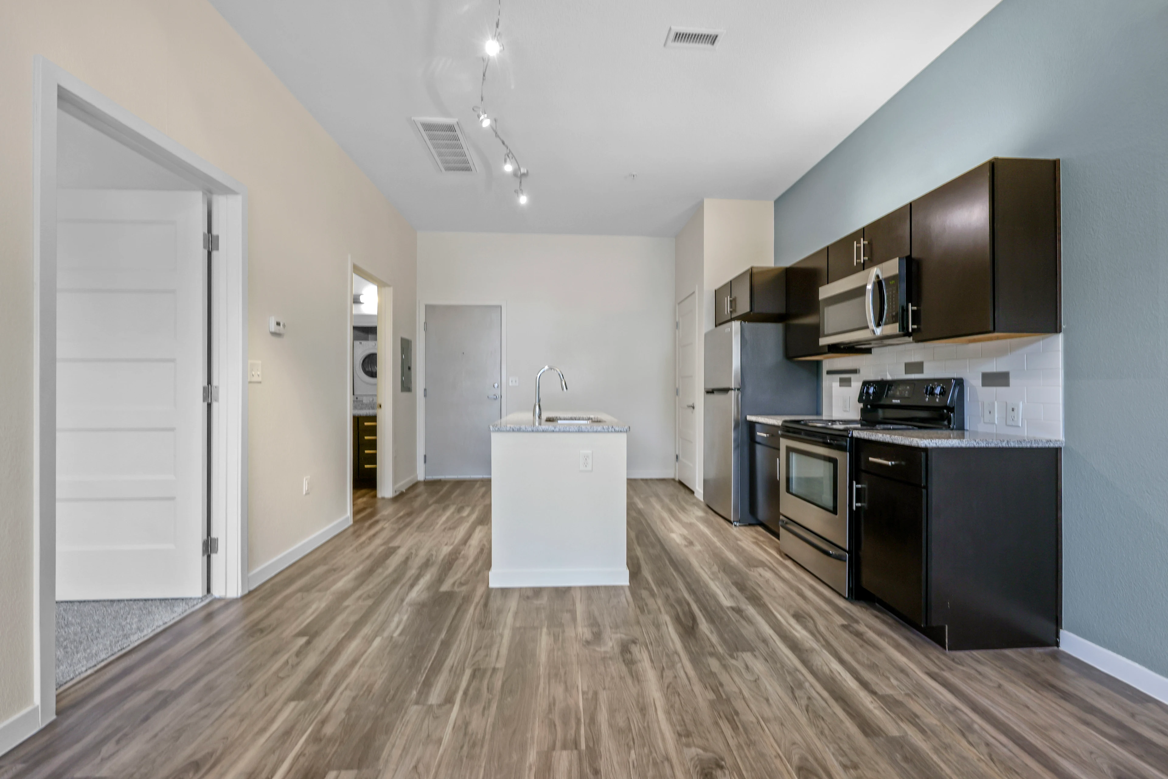 Kitchen with island and dark features