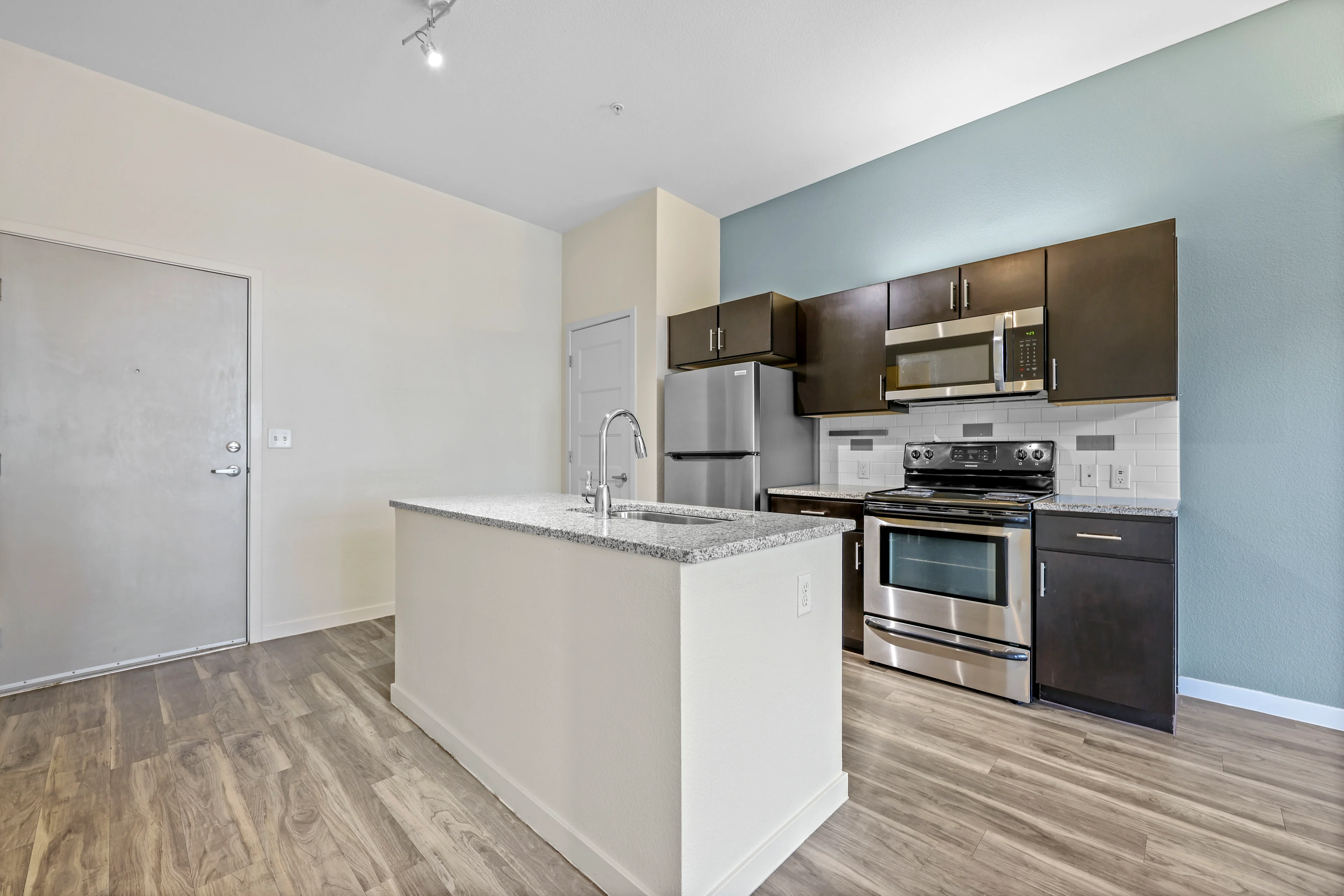 Kitchen with island and dark features