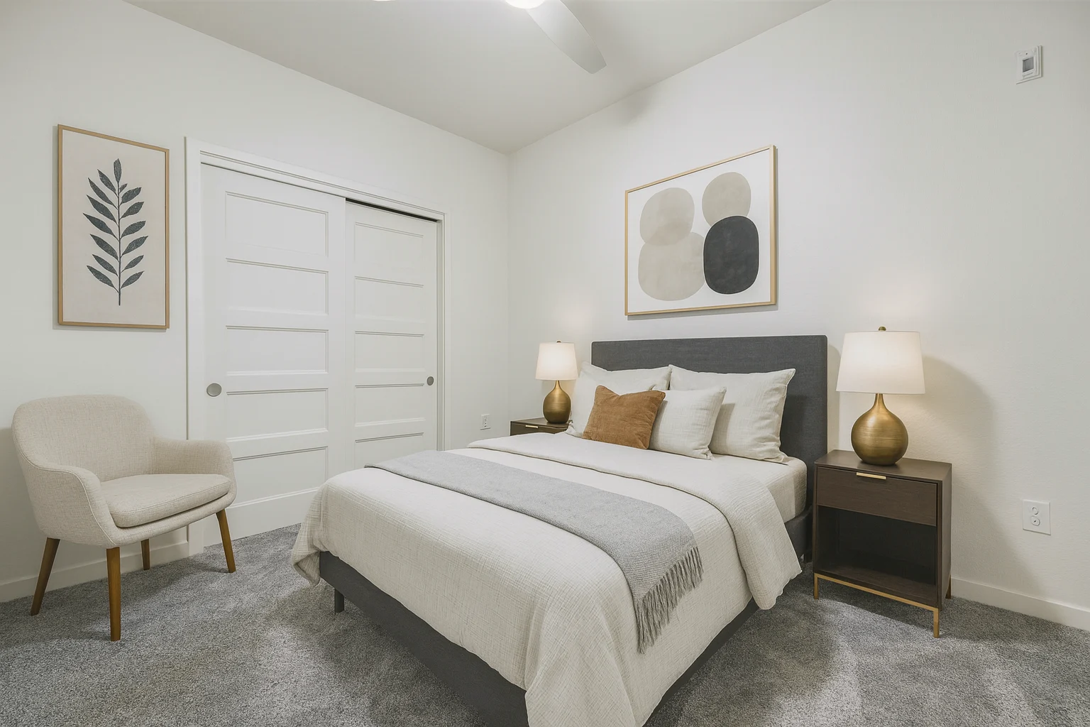 Bedroom carpeted with bed and closet