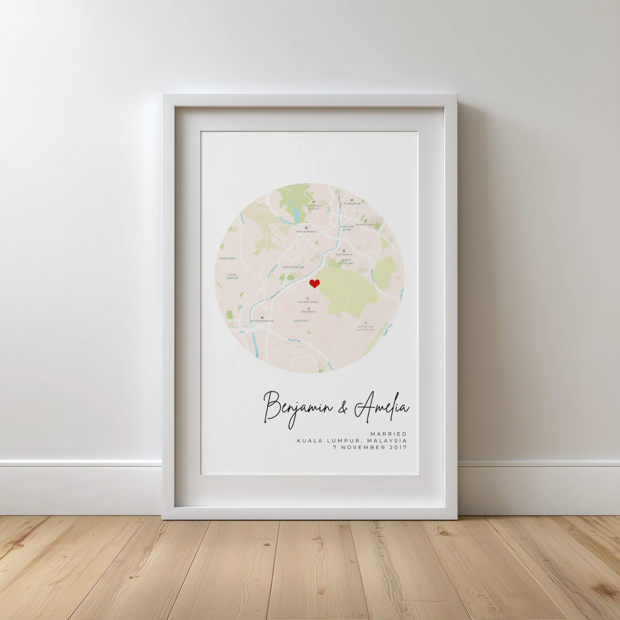 Framed map with a red heart marking Kuala Lumpur, Malaysia, with names Benjamin & Amelia and marriage date.