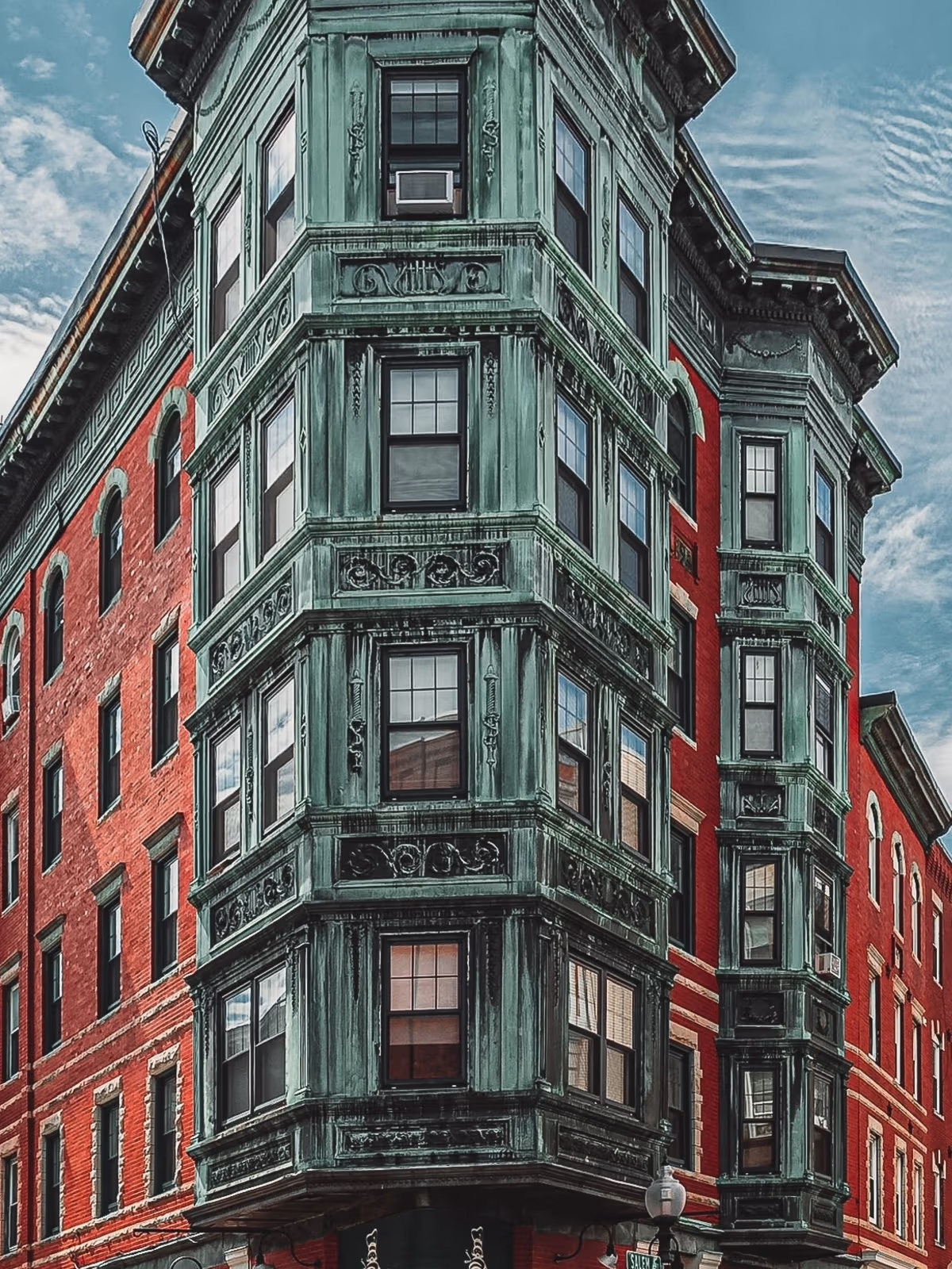 A weathered corner building in Little Italy, New York City