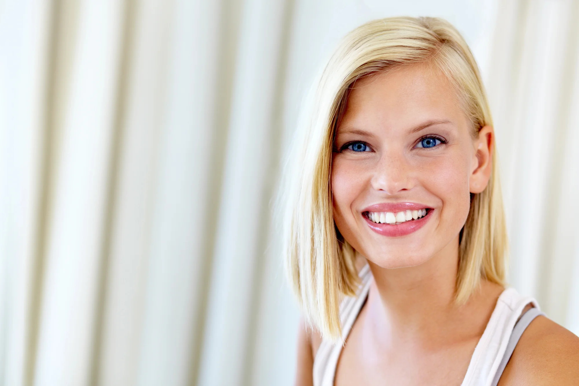 happy woman after teeth whitening in Easley, SC