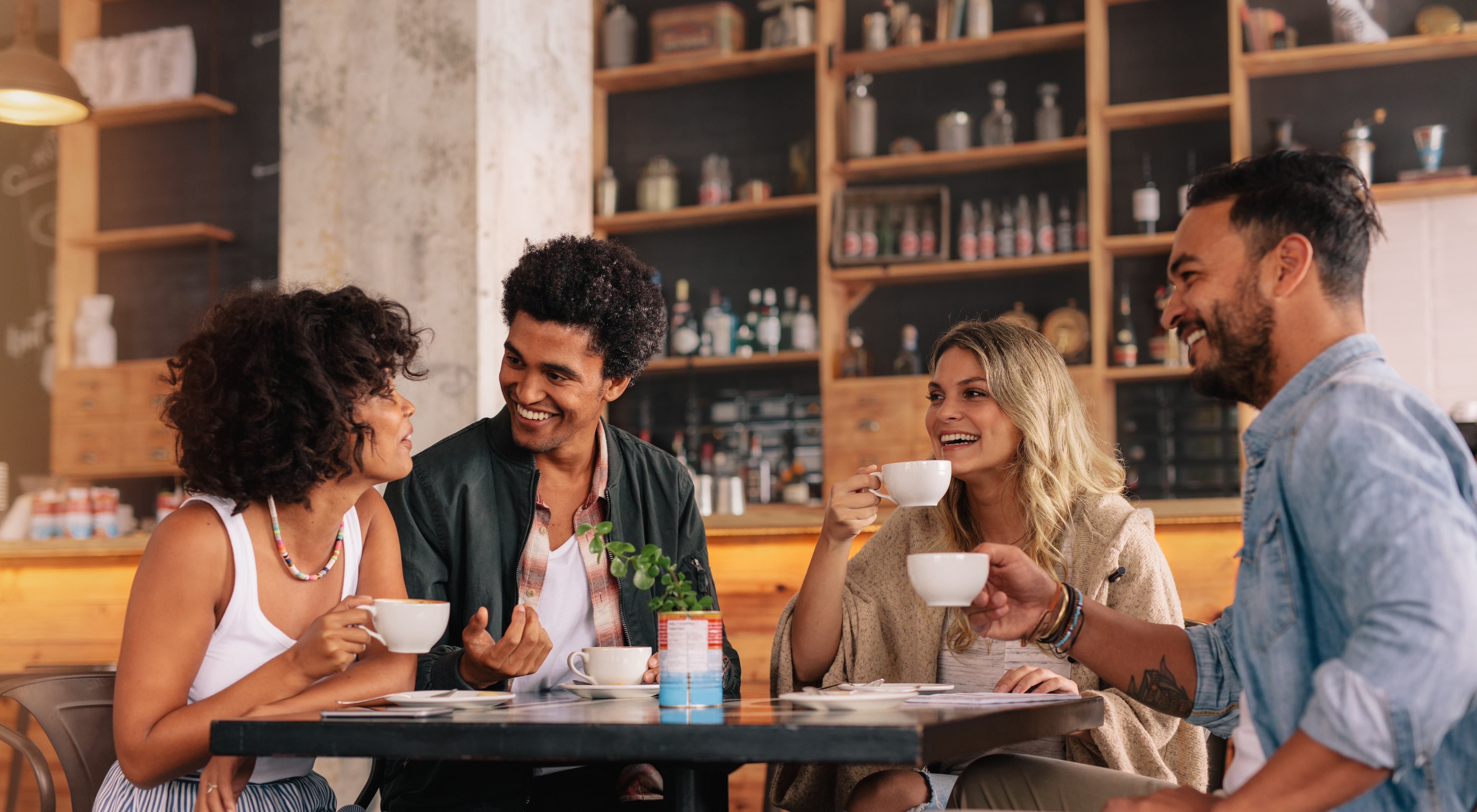 People sitting at table having coffee stock image