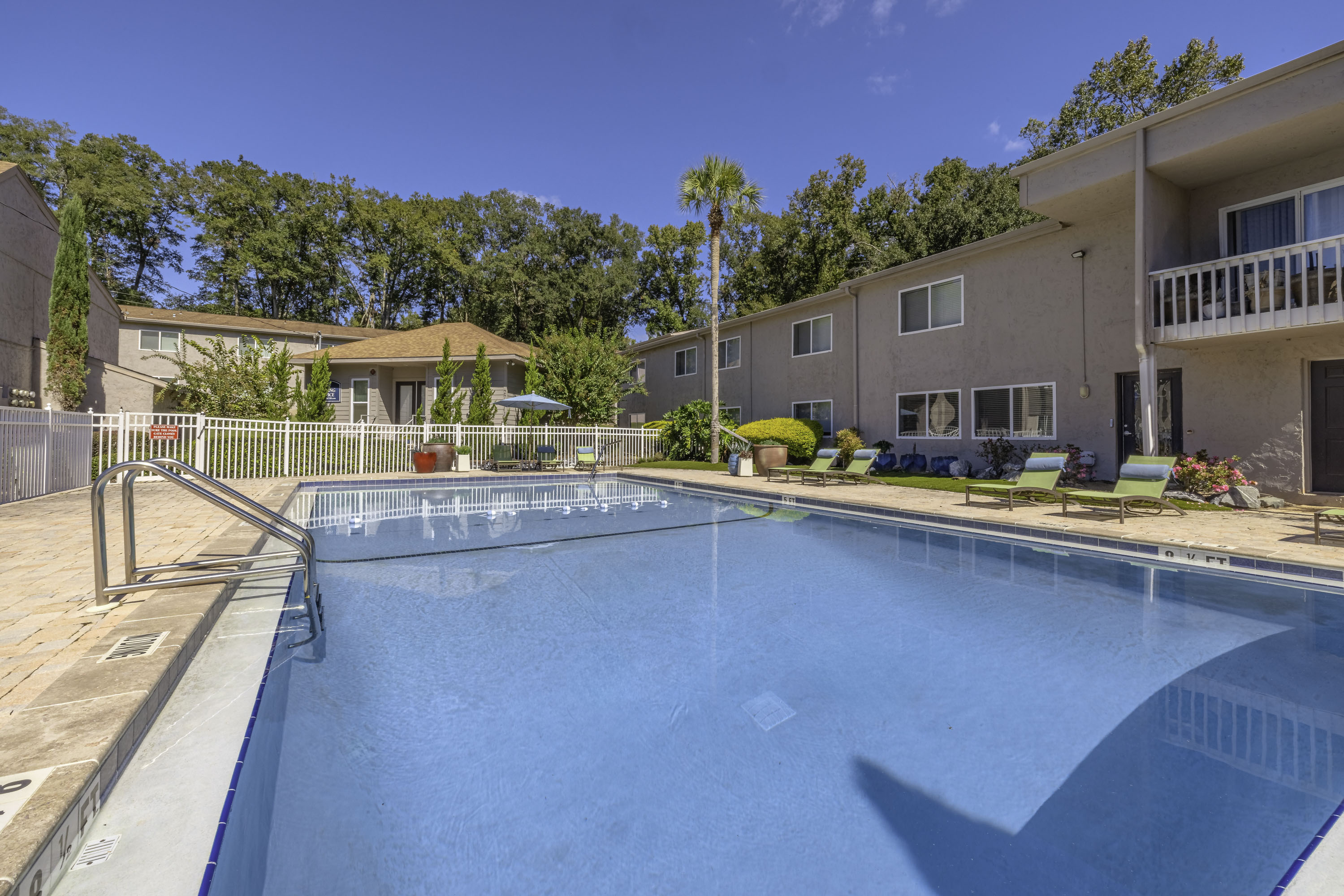 Pool with steps in and railing