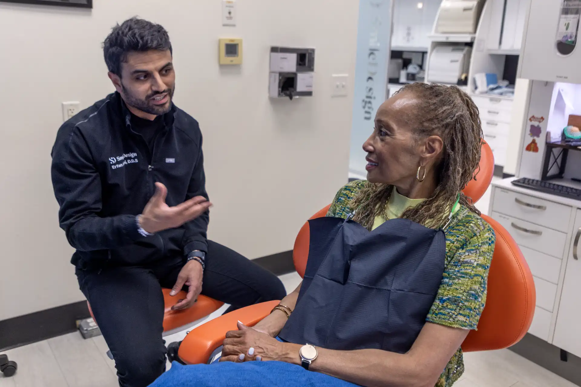 Dentist discussing dental implant treatment with a patient