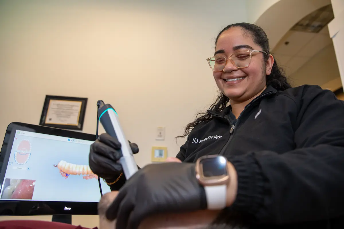 Smile Design Modern Dentistry team member taking a digital intraoral scan to plan Invisalign treatment in Durham, NC