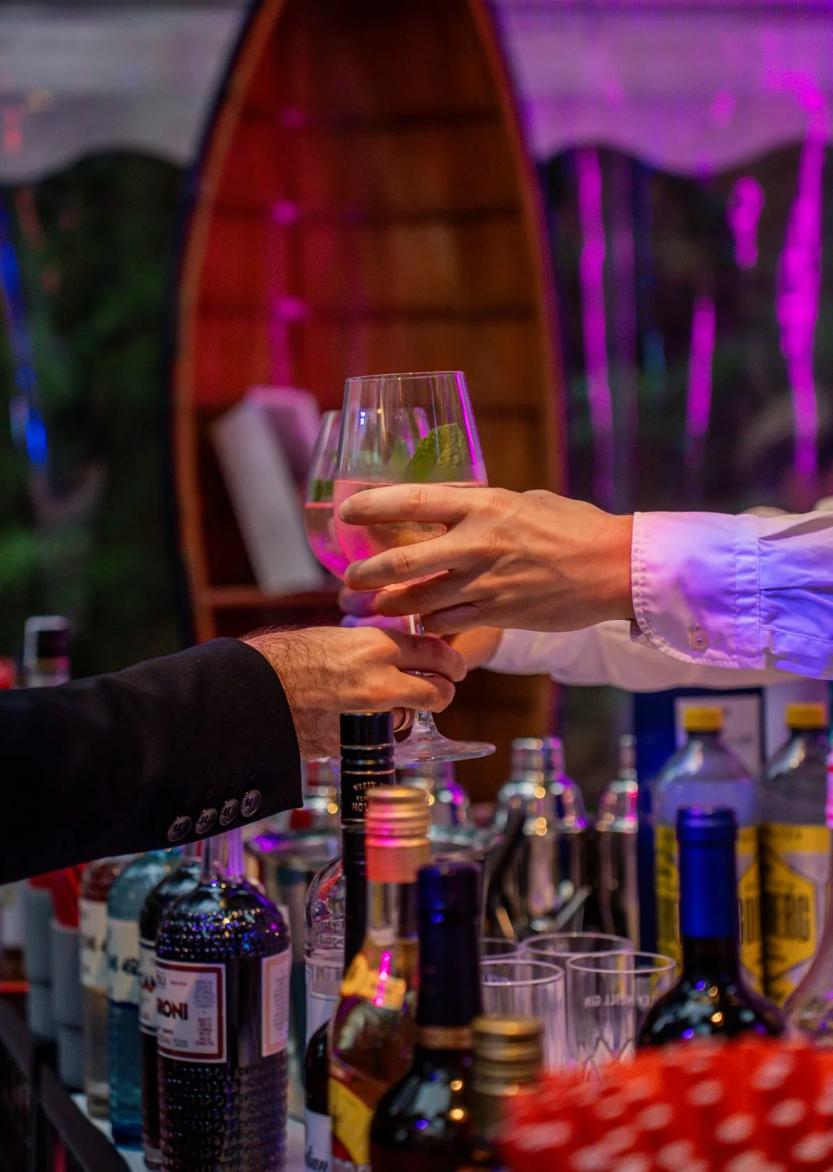 Evening bar, a drink being handed over