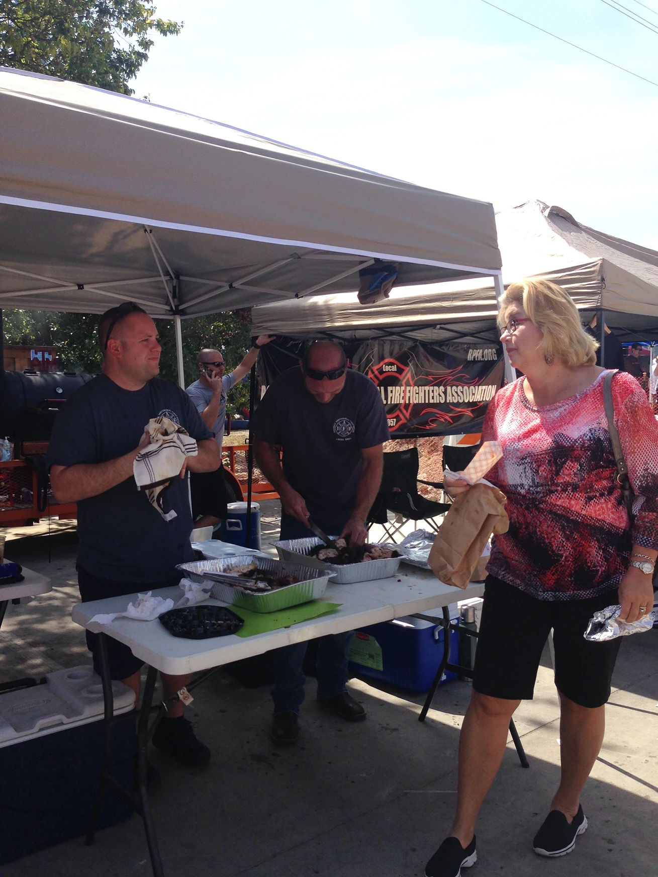 RPFA members serving food at a Rockwall community event