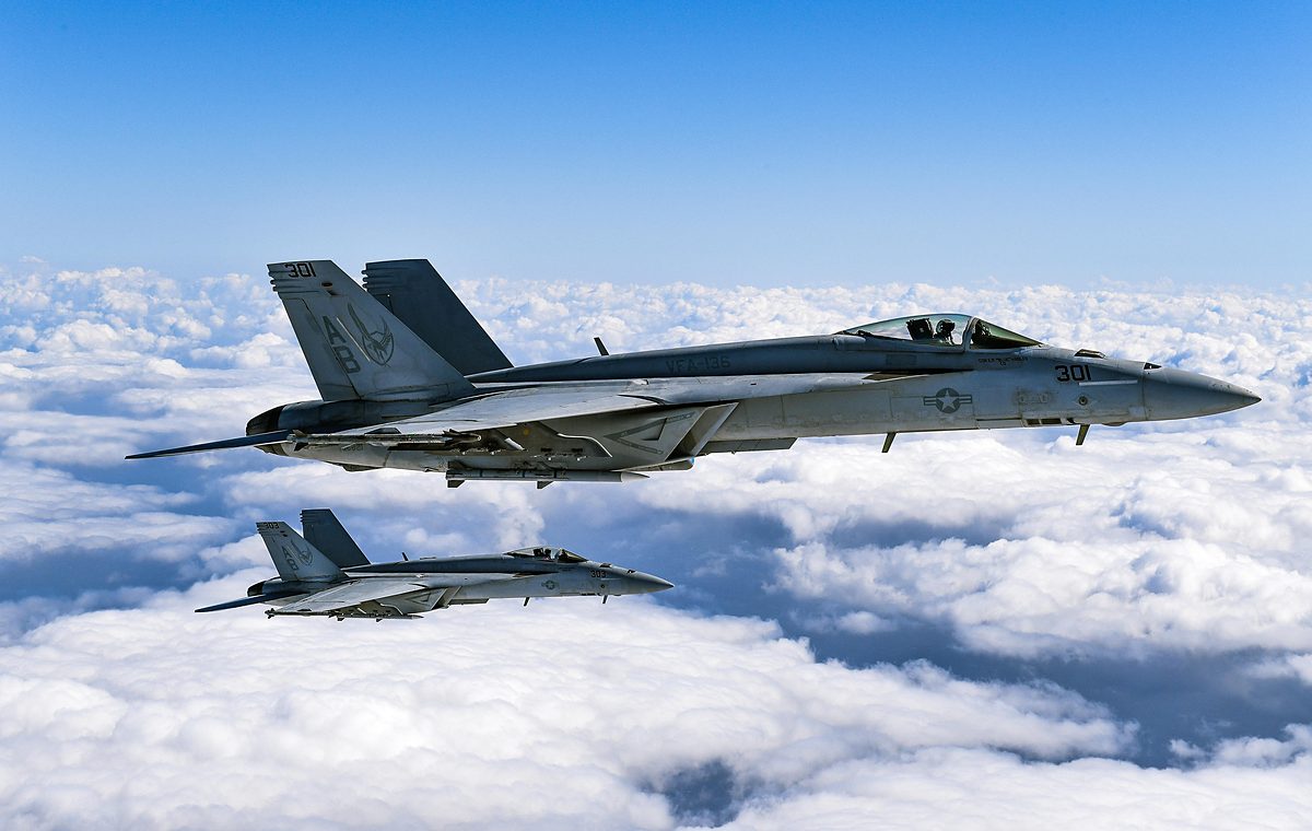Two military fighter jets in flight