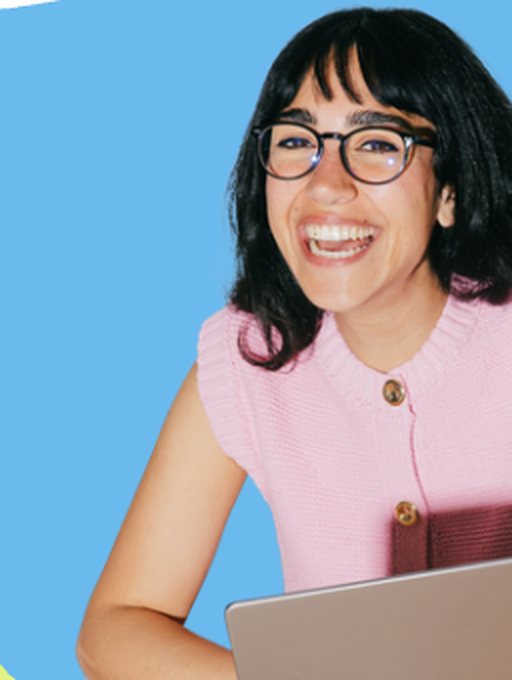 Growth engineer smiling at a laptop