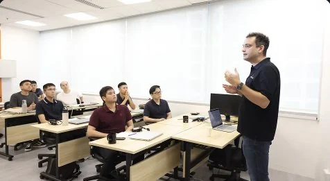 Trainer leading a small classroom session