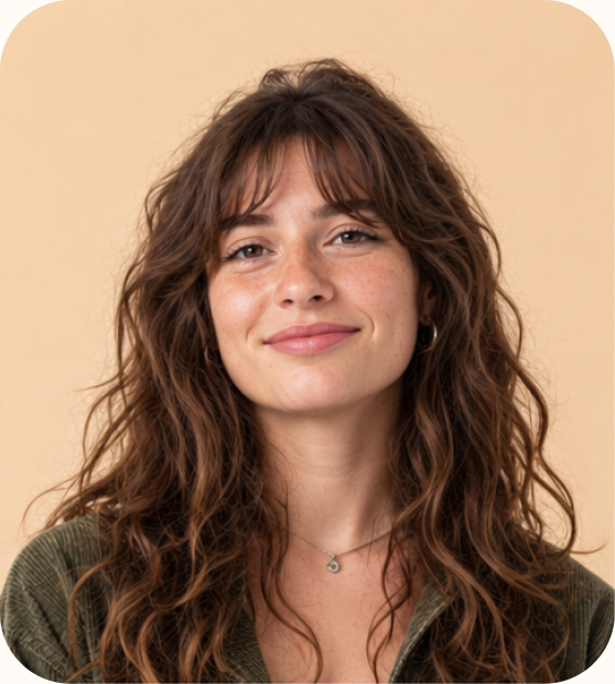 Smiling Aleph Cloud DevOps trainee with curly hair