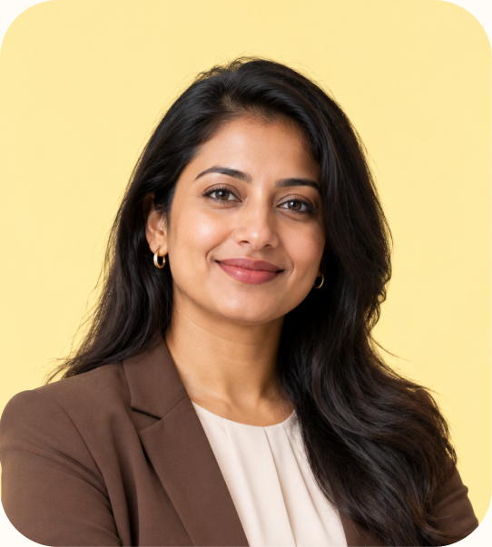 Smiling Aleph Cloud DevOps engineer in a brown blazer
