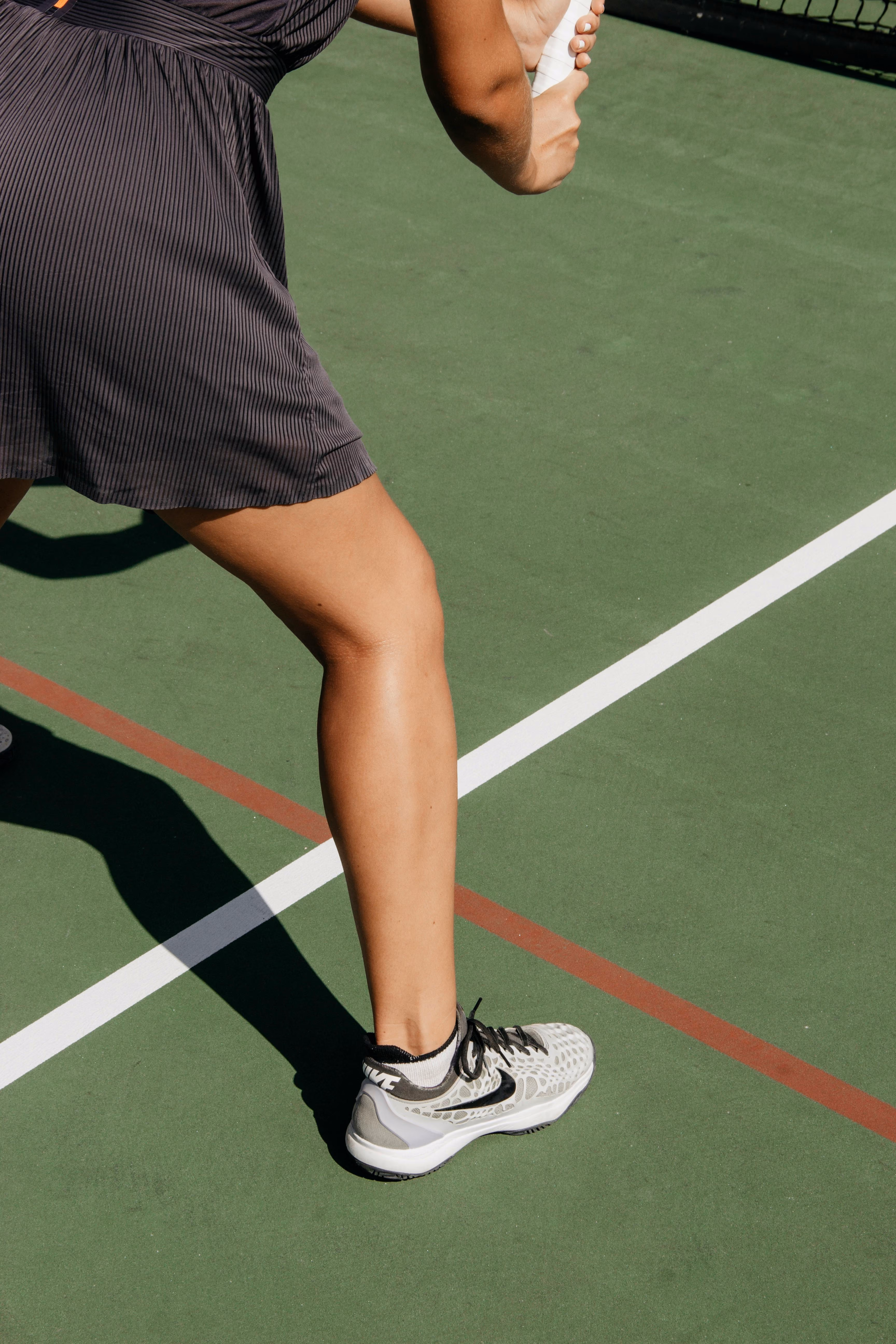 Person on tennis court foot near the line stock image