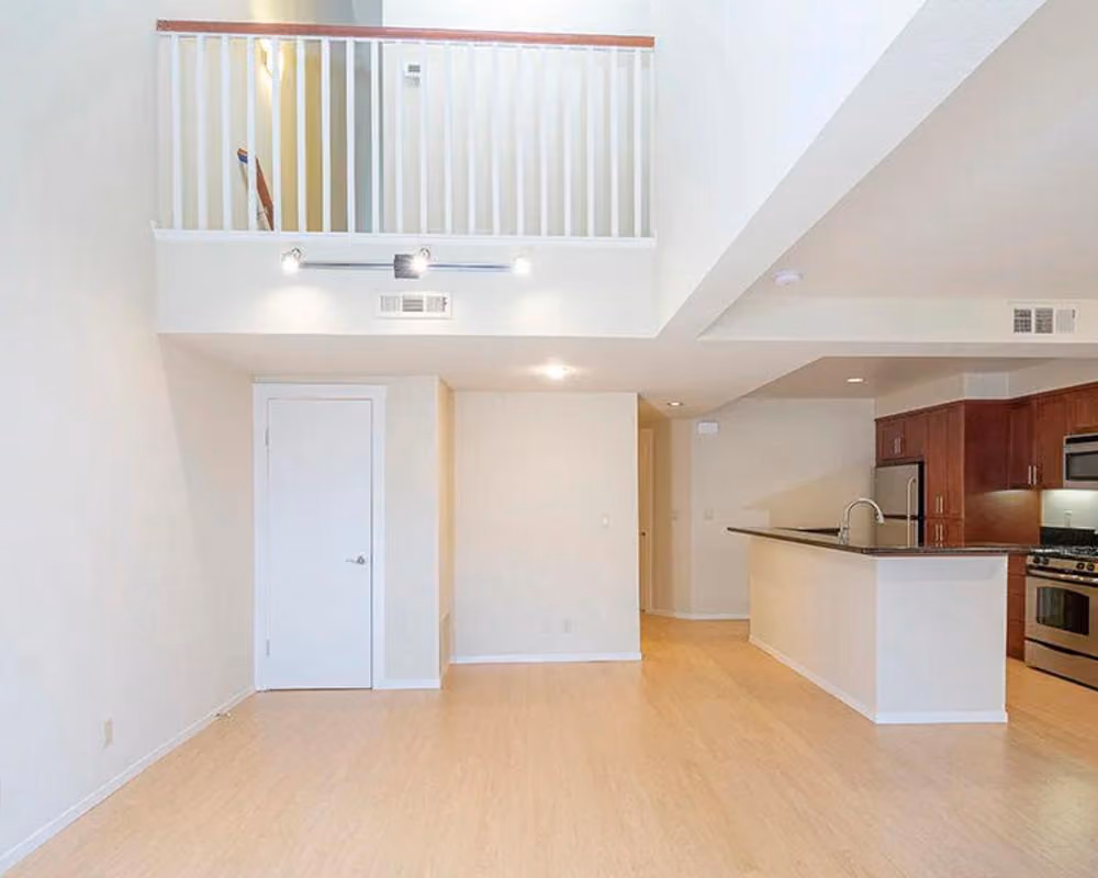Living room and kitchen with view of overlook from second floor