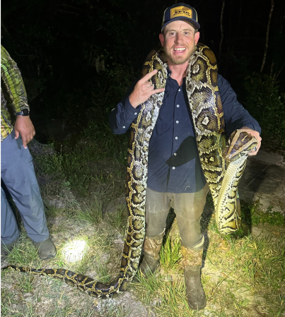 Captain Michael with a python caught in the Everglades