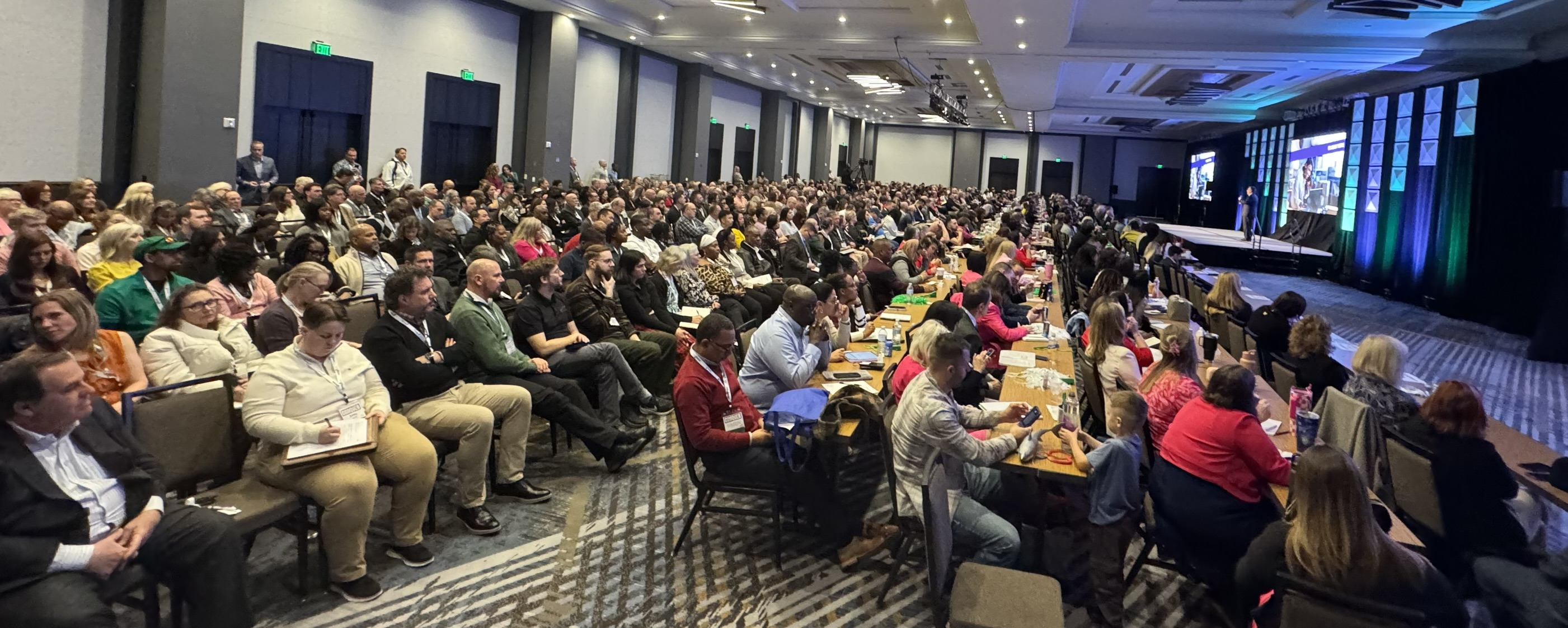 Attendees in a general session at the WealthWave convention