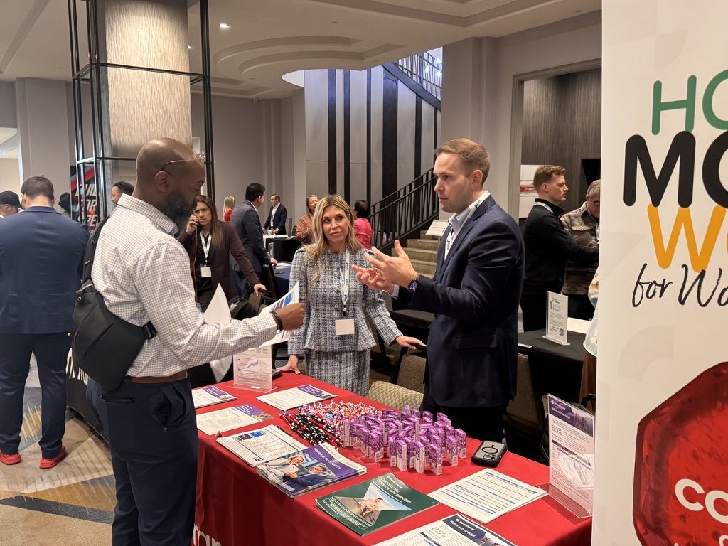 Attendees networking at the WealthWave convention