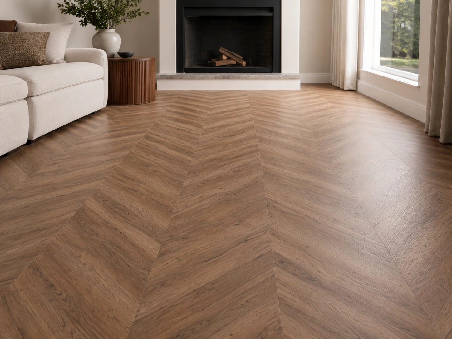 Living room with herringbone wood flooring and a fireplace