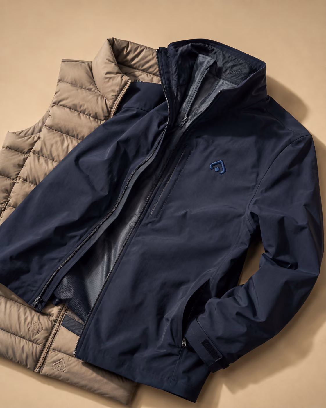 Navy insulated jacket and vest layered together