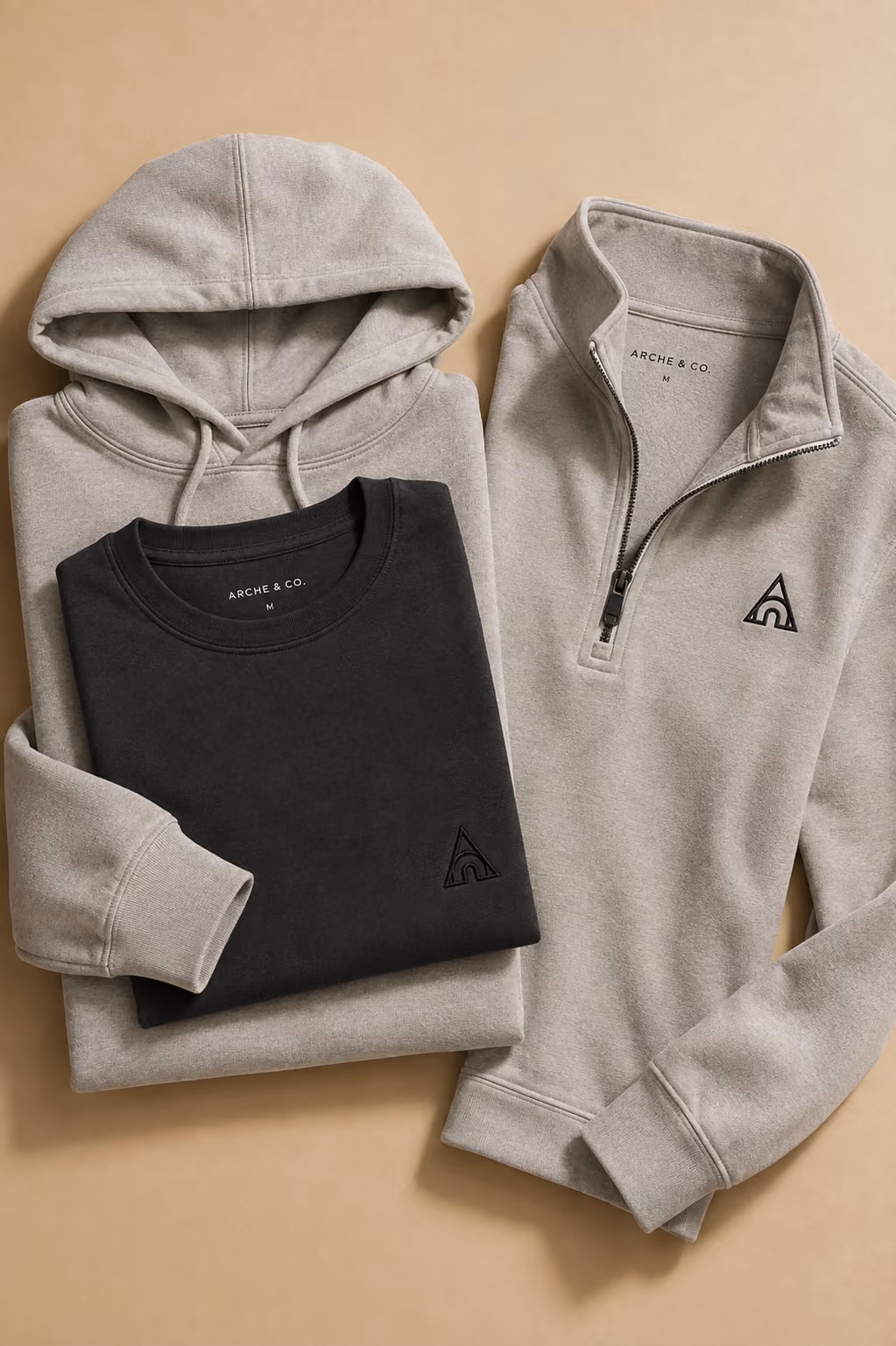 Quarter-zip fleece and crewneck sweater folded together