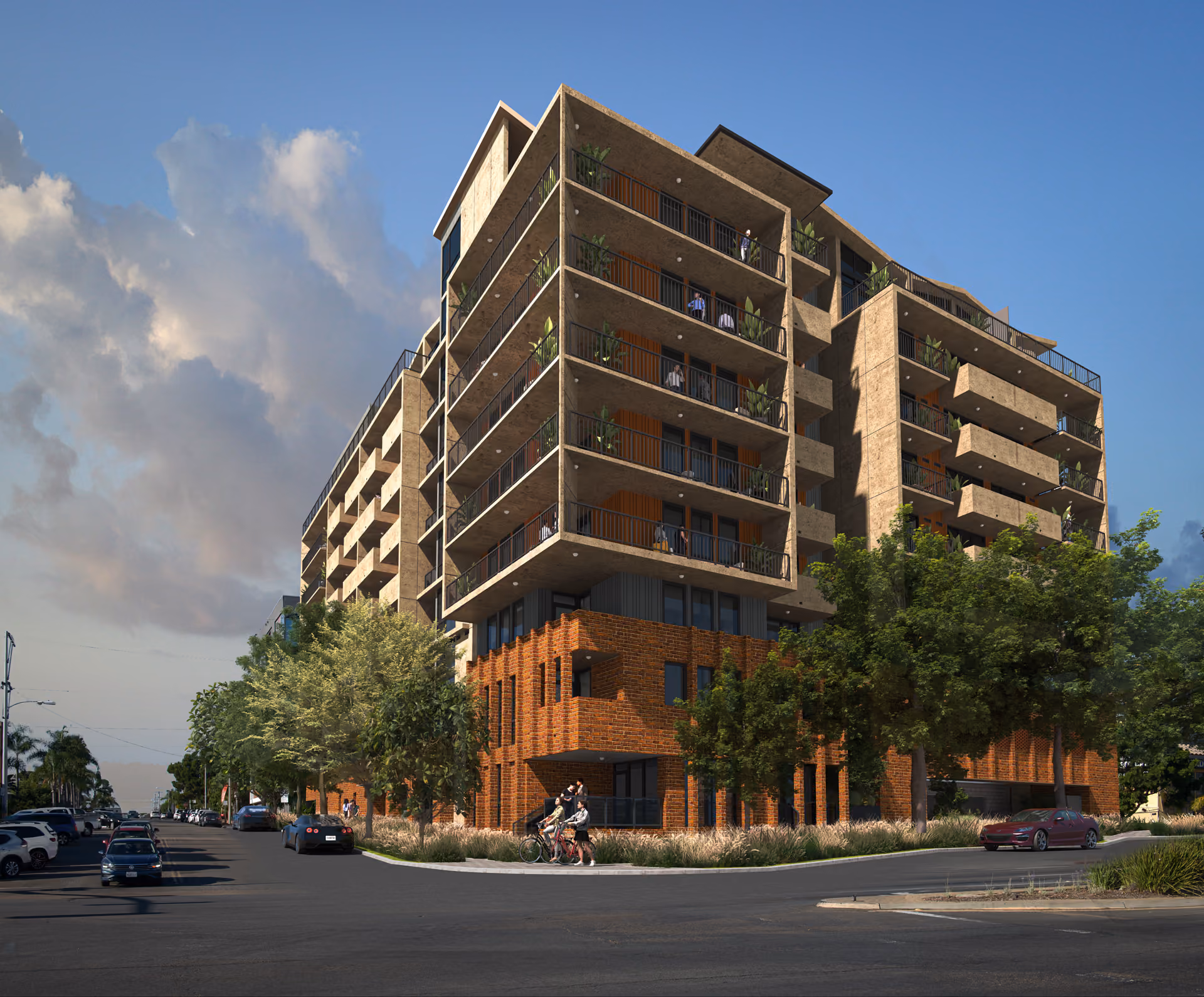 Modern multi-story apartment building with balconies, brick lower floors, trees, cars, and people outside.