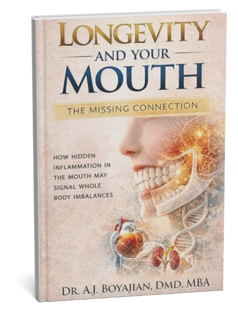 Book titled Longevity and Your Mouth by Dr. A.J. Boyajian with an anatomical face and organs illustration.