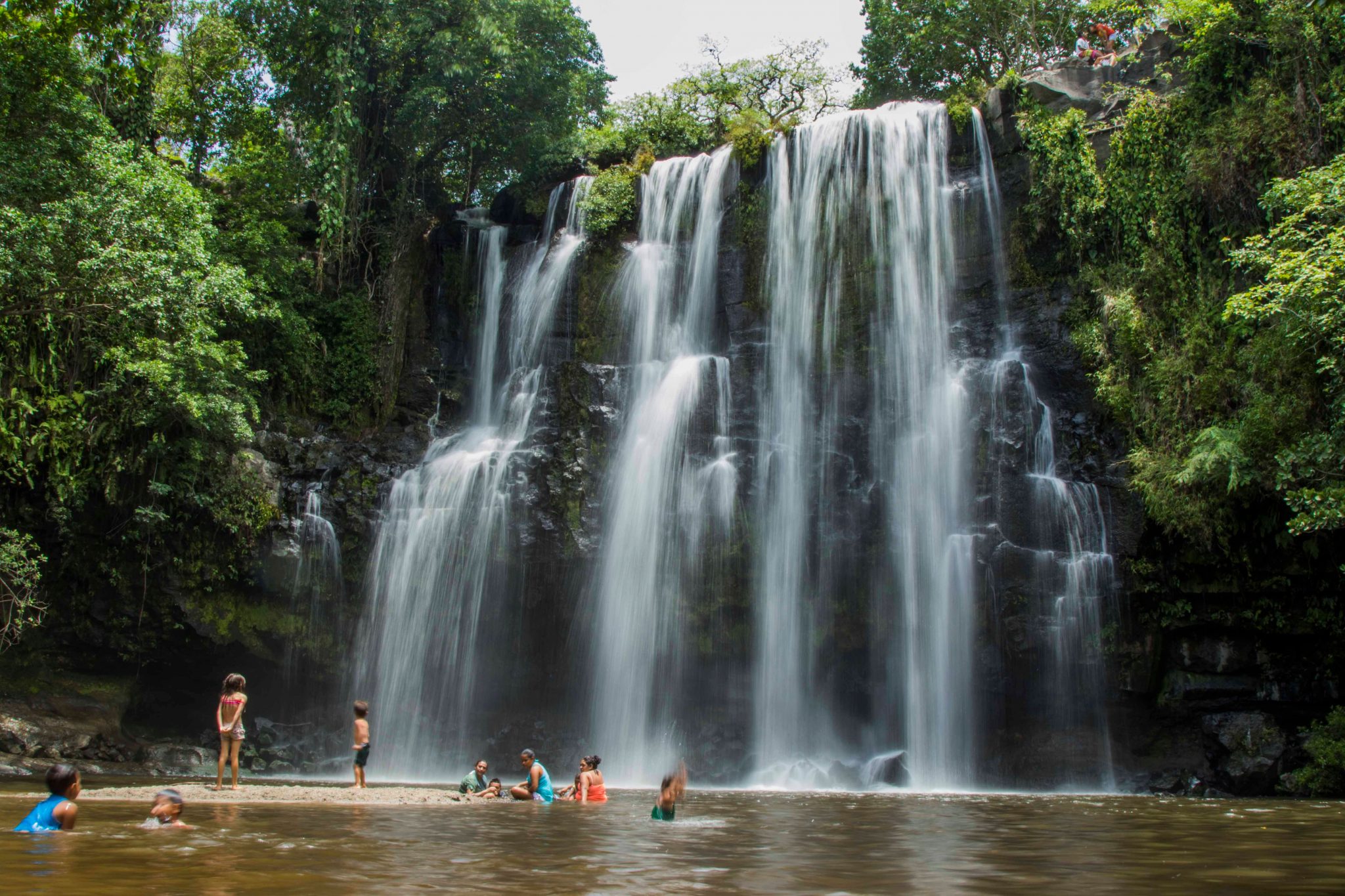 Swimming at the base of a Costa Rica waterfall