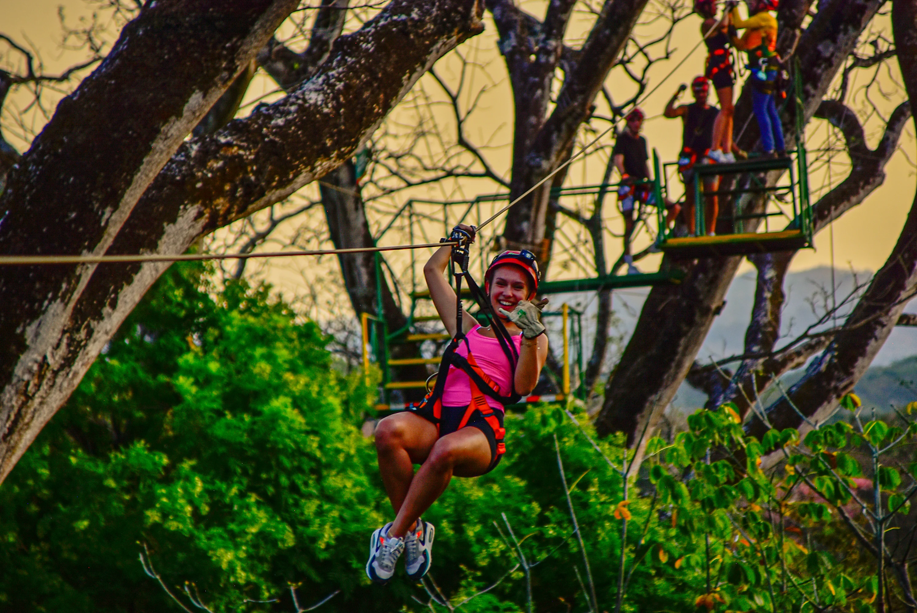 Guest flying on a zipline over the Guanacaste forest near Tamarindo