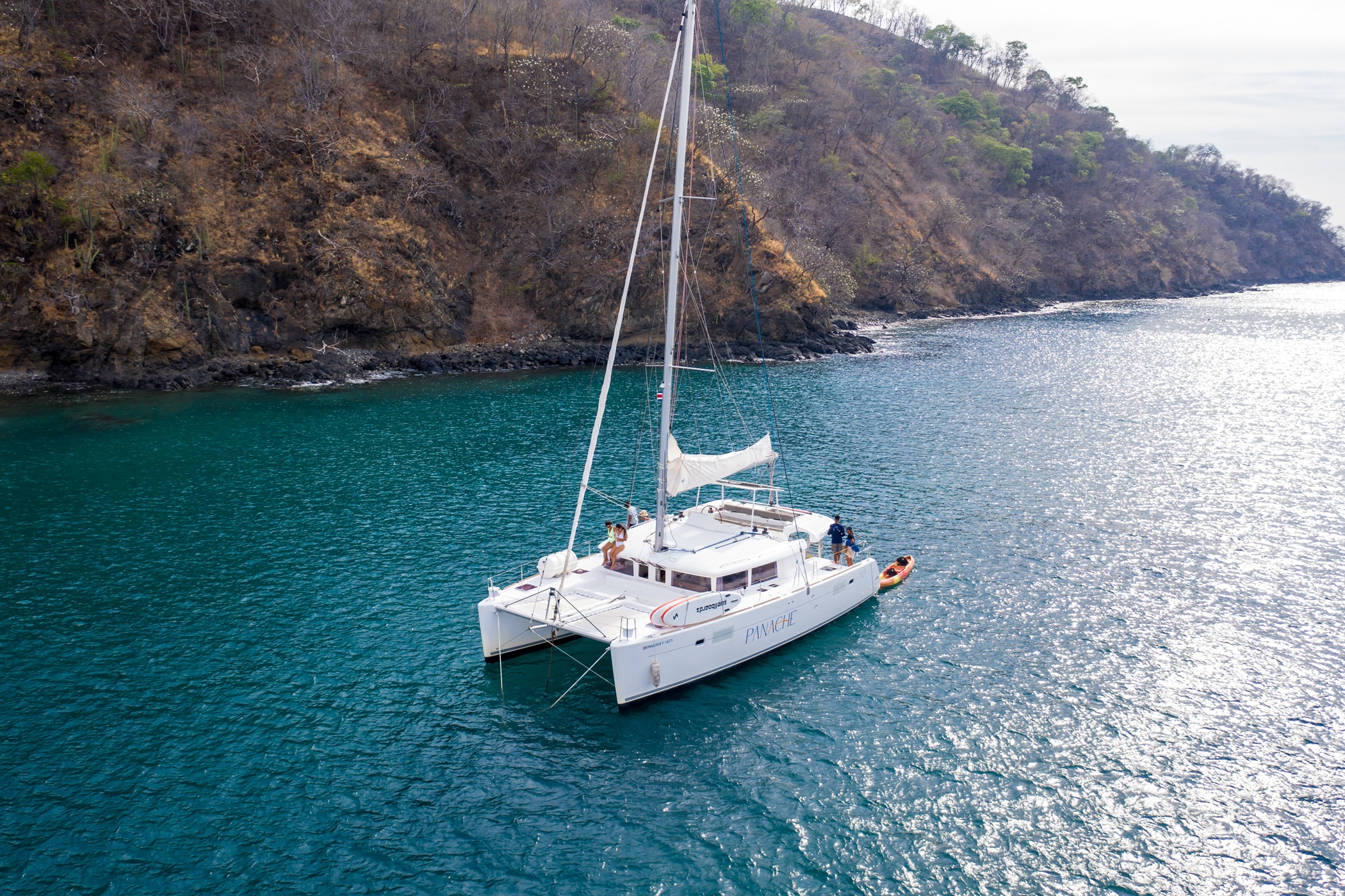 Panache catamaran anchored in a turquoise cove on the Guanacaste coast