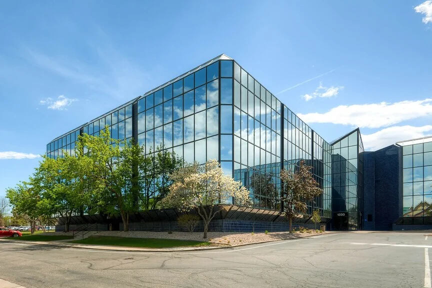 North side of 120th Ave — look for the building with the Mountain Range Dentistry sign, across from the large glass building.