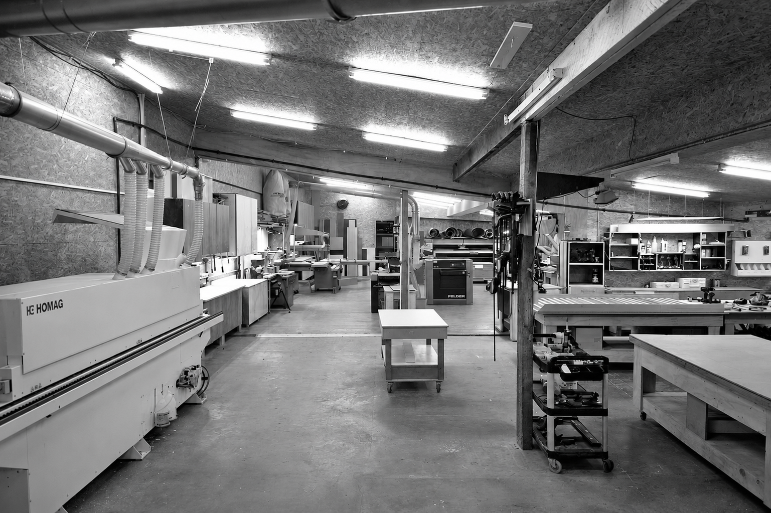Evolution’s Auckland workshop with cabinetry machinery, work benches and extraction equipment