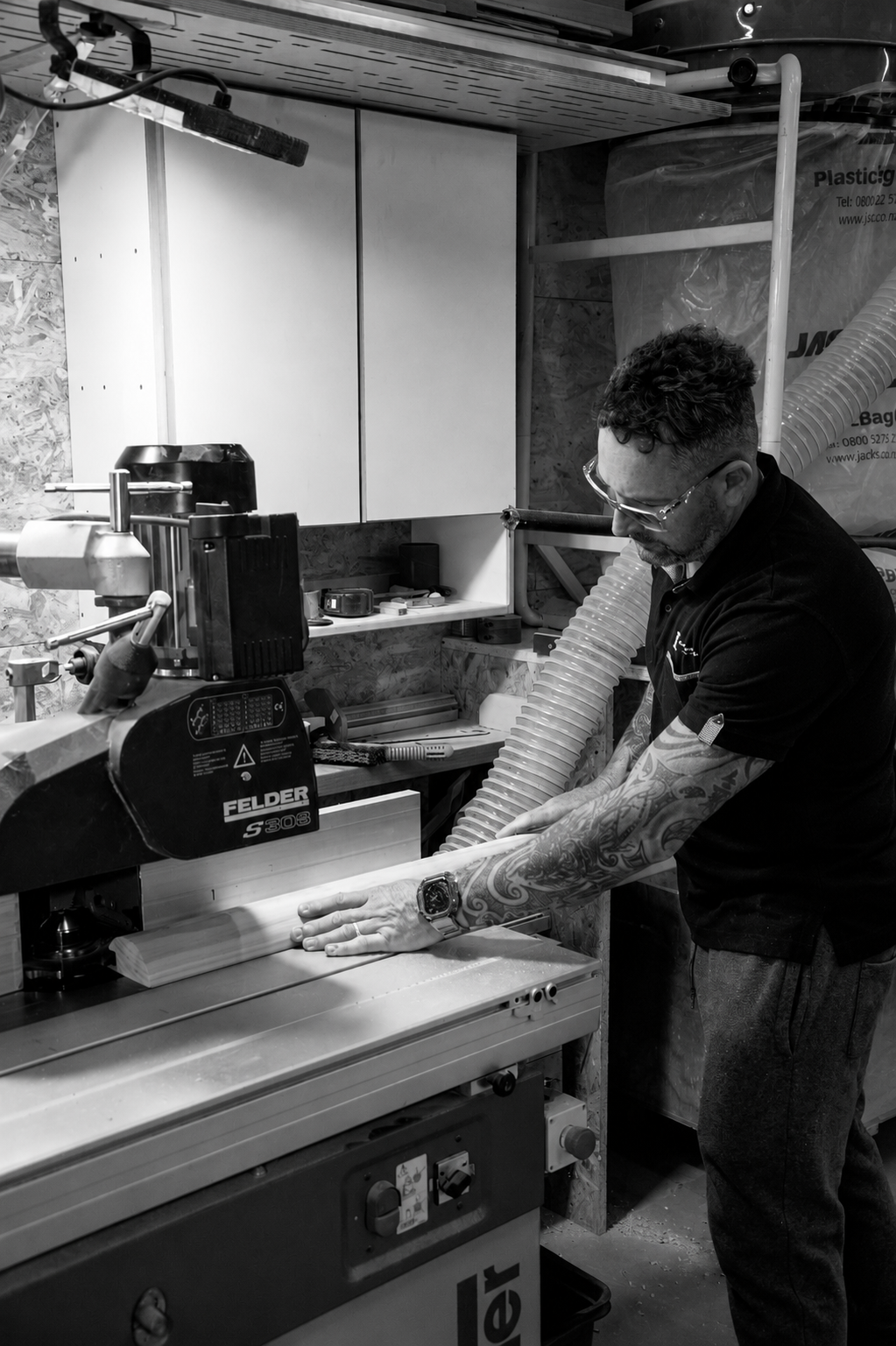 Evolution team member machining timber in the Auckland workshop