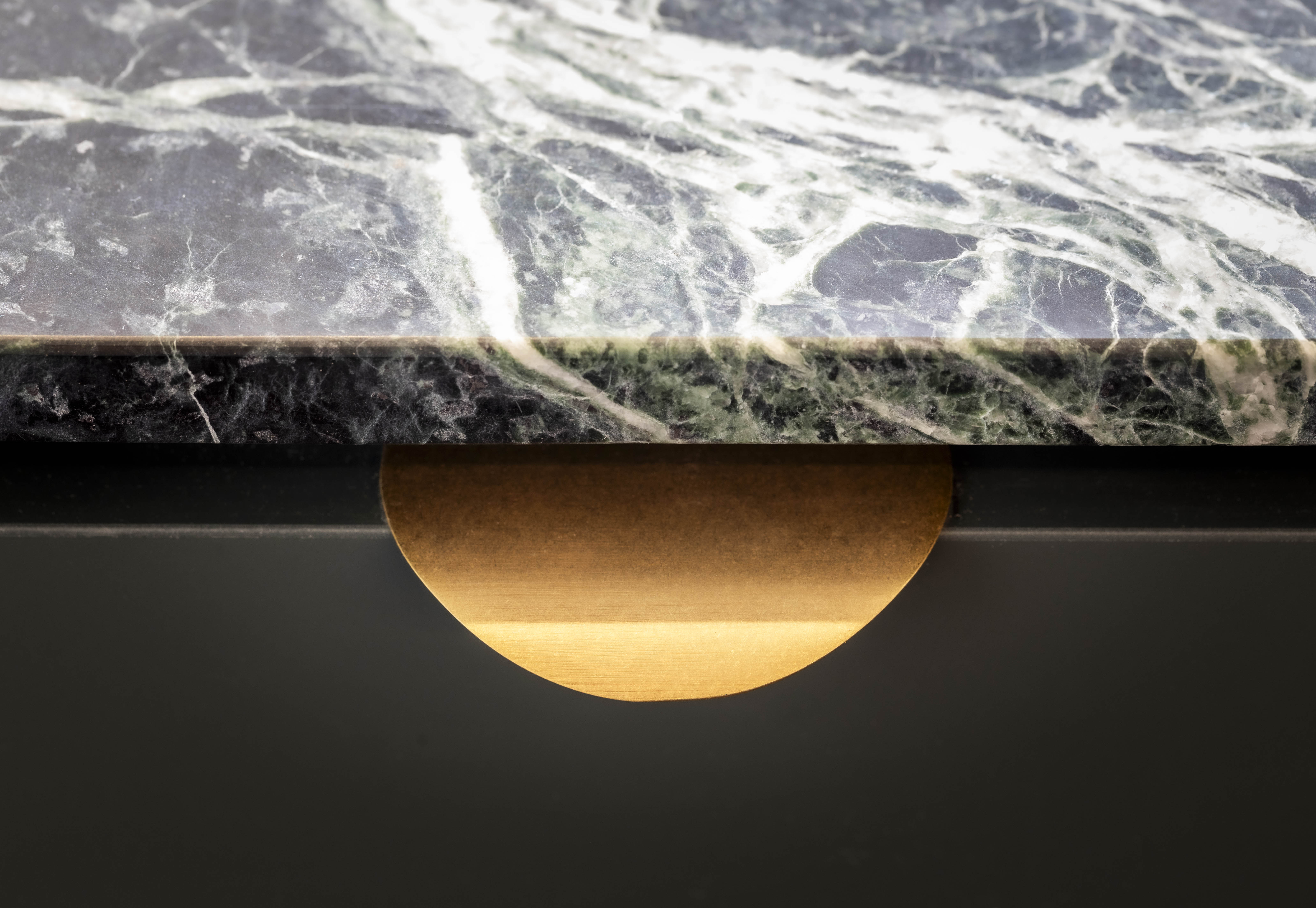 Brass pull and natural stone cabinetry edge detail at George Court Apartment