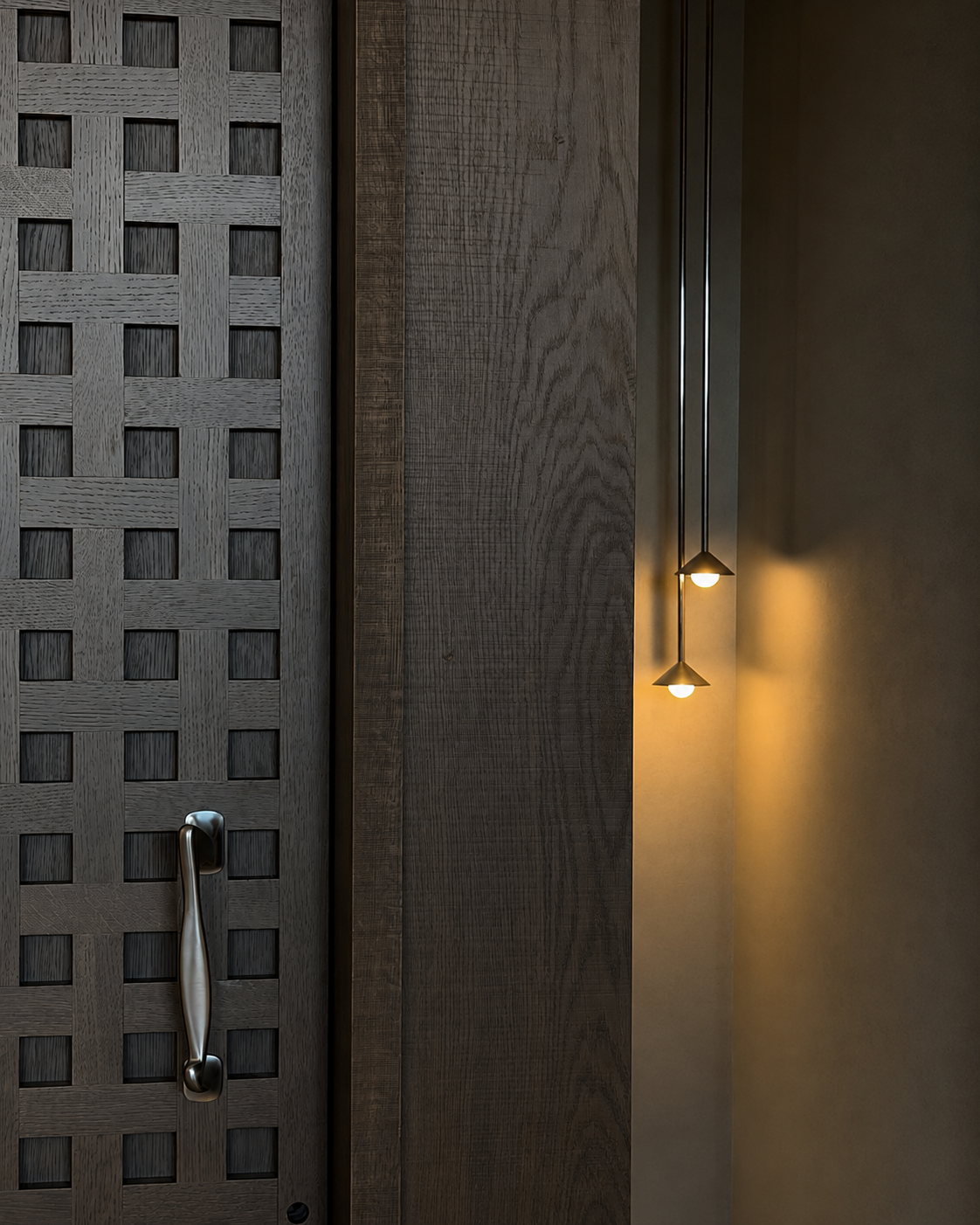 Woven timber panel, custom hardware and pendant-light detail at Coastal Residence