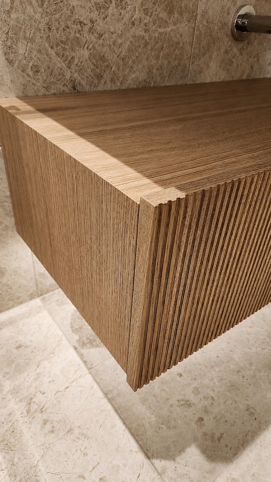 Solid oak ribbed vanity drawer detail at Mauao Residence