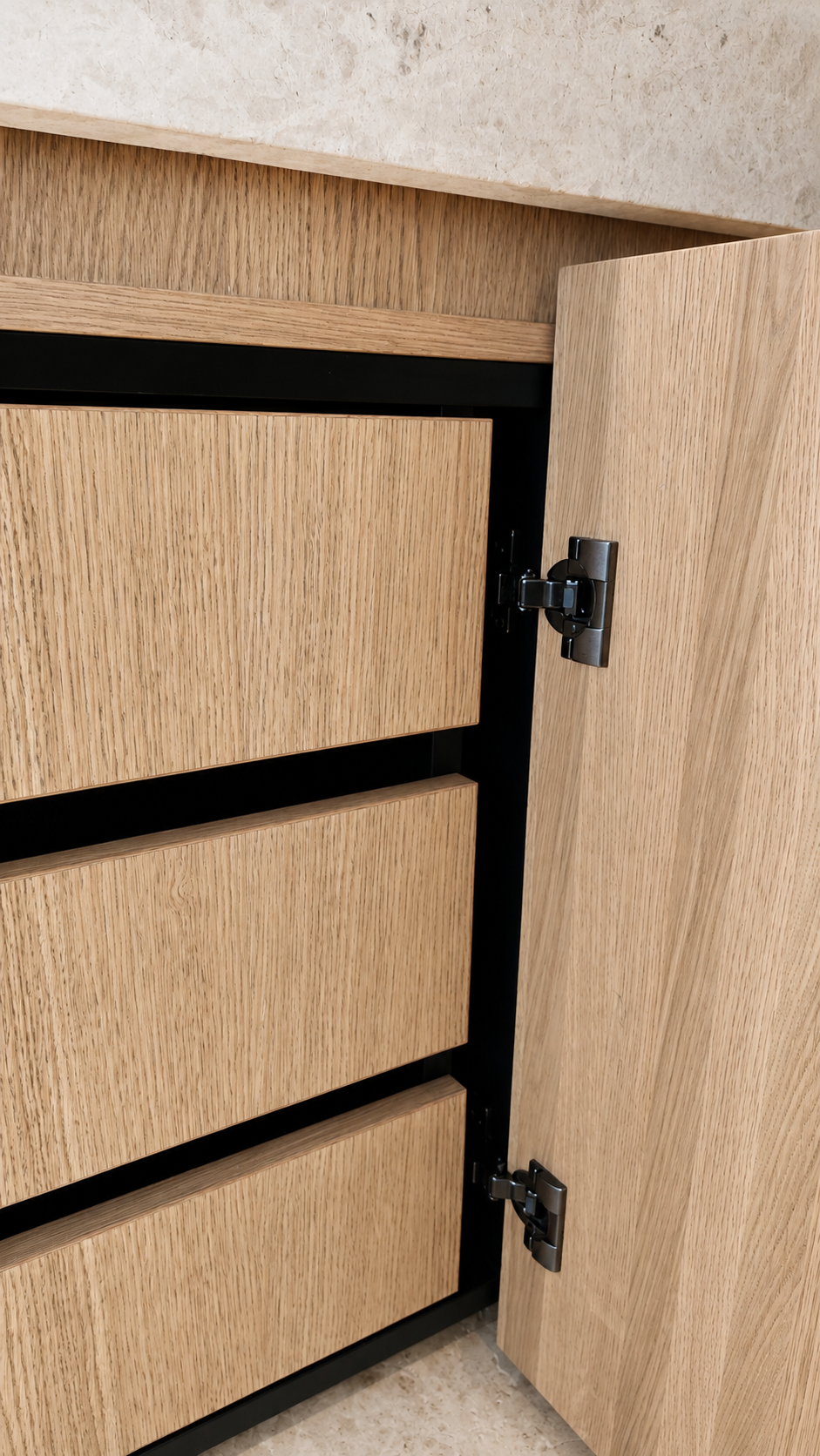 Internal oak vanity drawers and concealed cabinet hardware at Mauao Residence