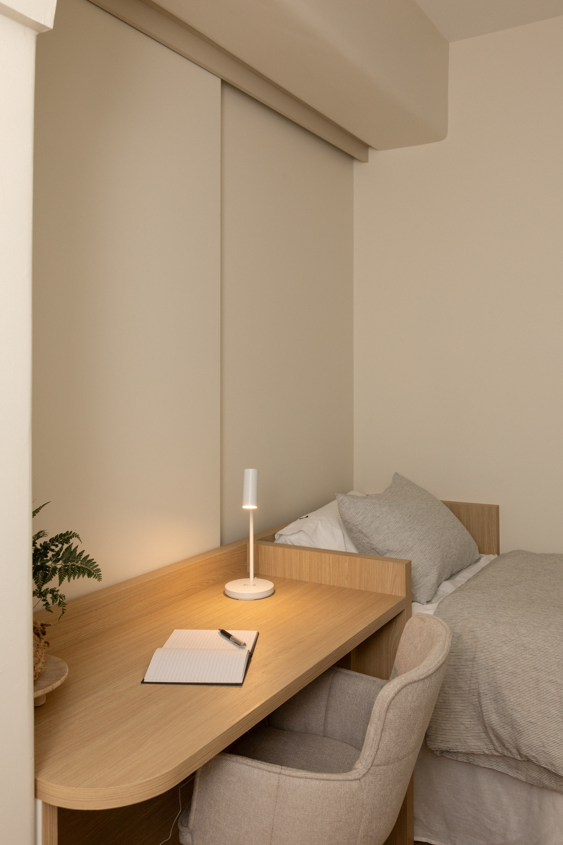 Integrated timber desk and bedside joinery within the Westminster Court bedroom