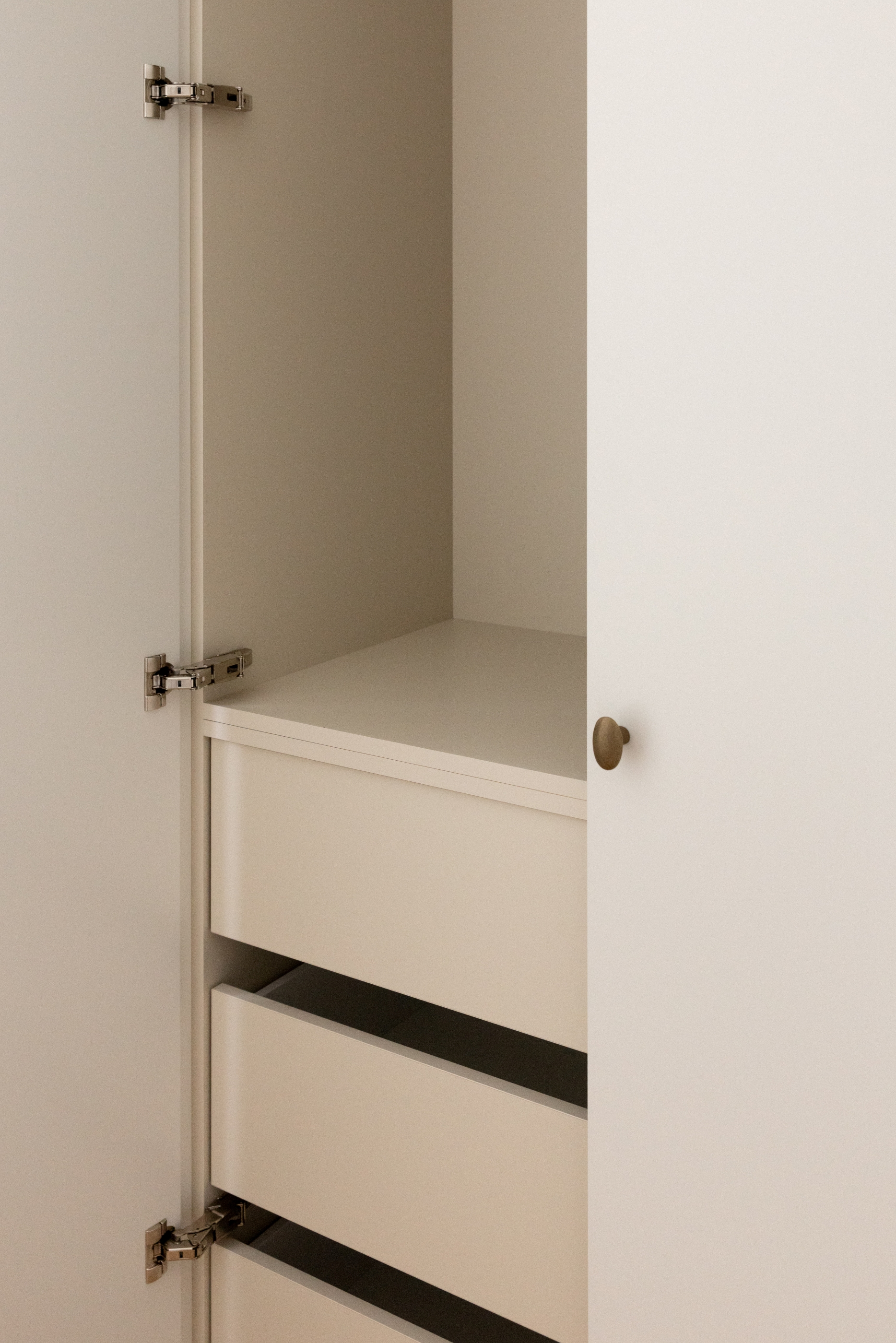 Open cabinetry at Westminster Court showing concealed internal drawers and hardware