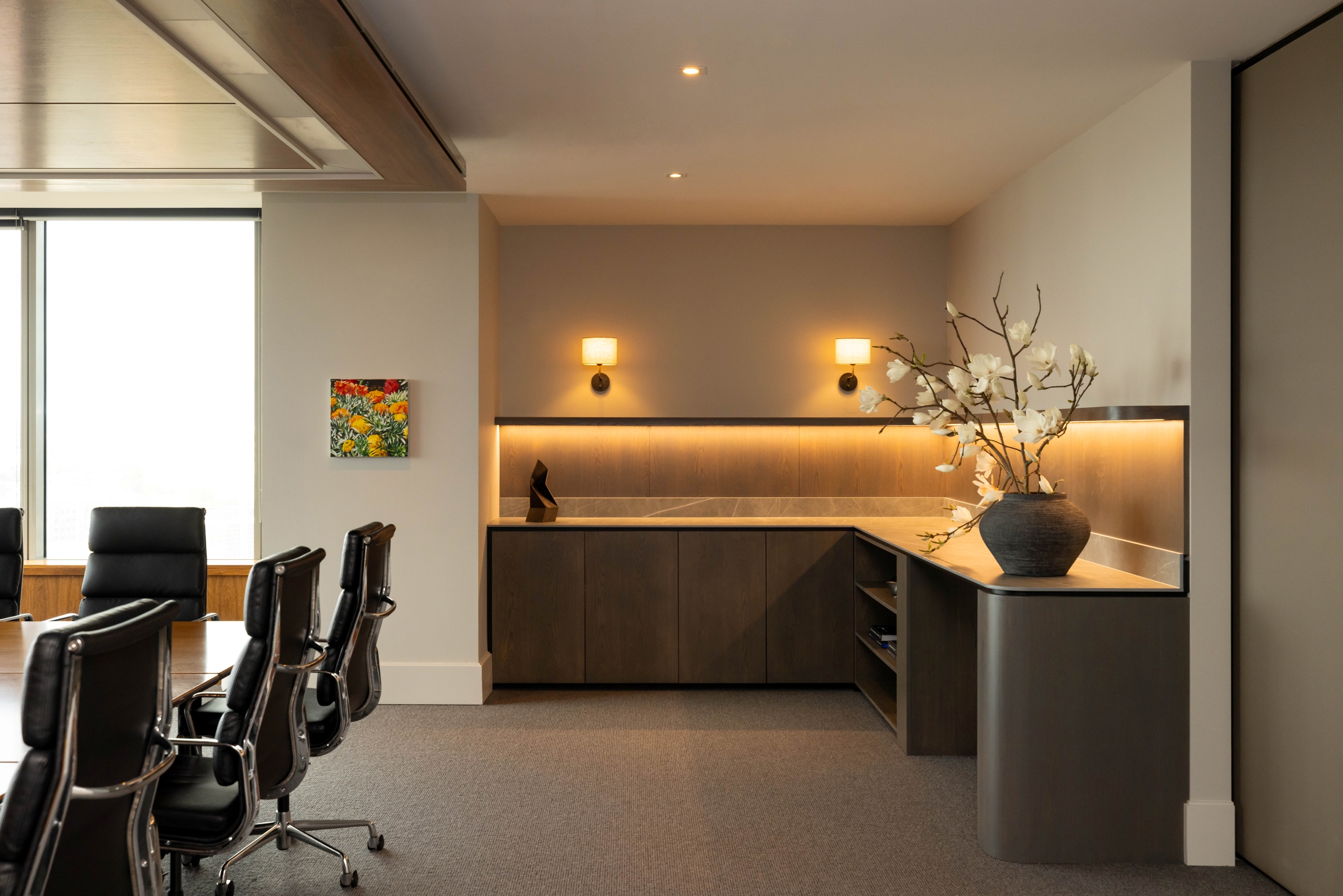 Russell McVeagh meeting room with custom cabinetry, integrated lighting and curved timber return