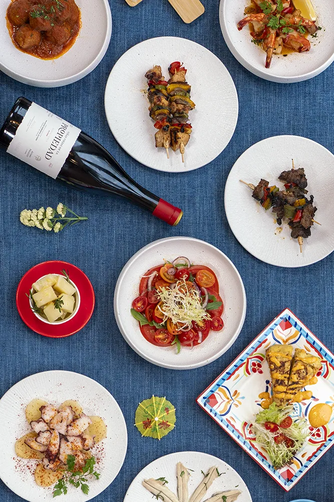 several tapas and a bottle of wine