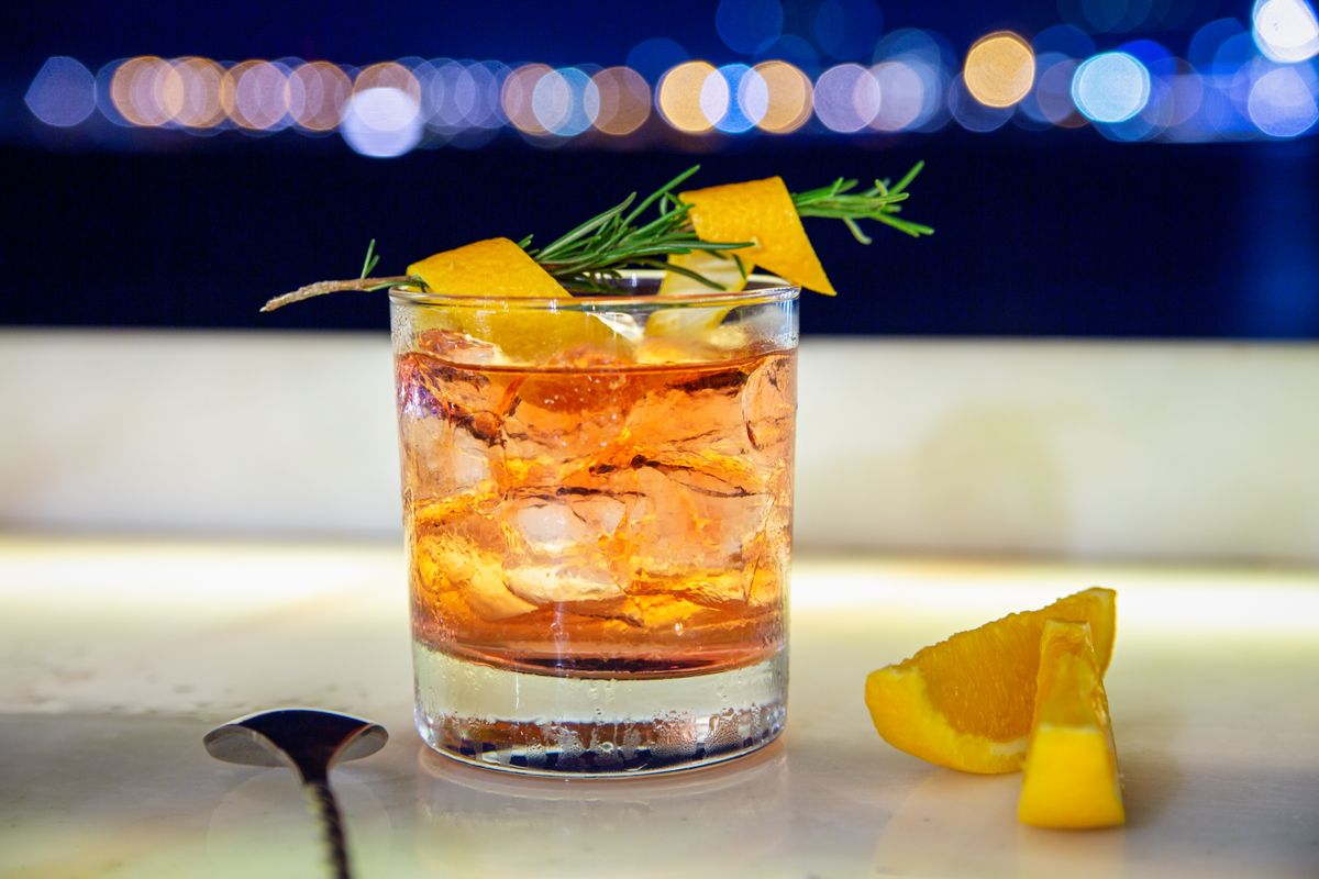 Placeholder stock photo of an Old Fashioned cocktail (temporary — to be replaced with approved ARIYA photography)